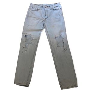 Original use highly distressed light washed jeans, size 34
